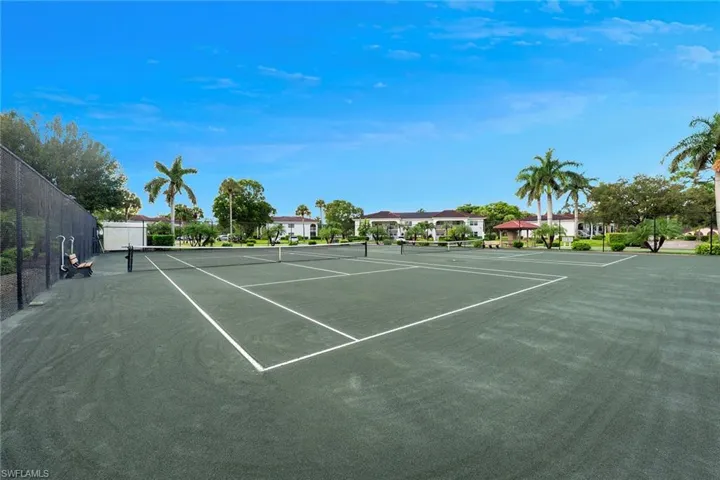 View of tennis court featuring community basketball court