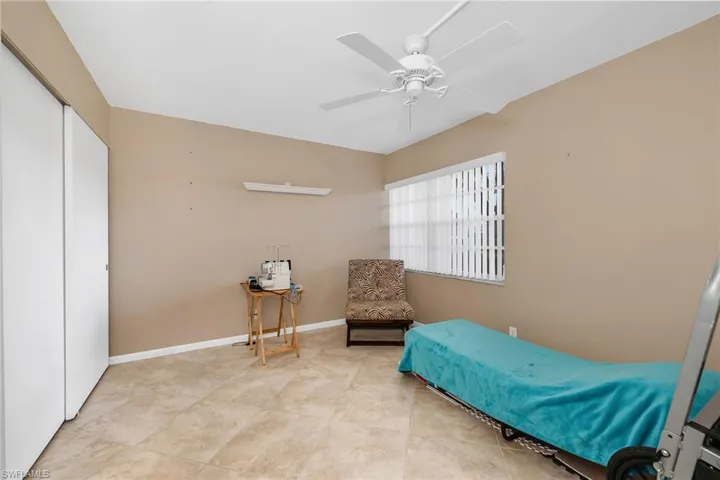 Bedroom featuring a closet and a ceiling fan