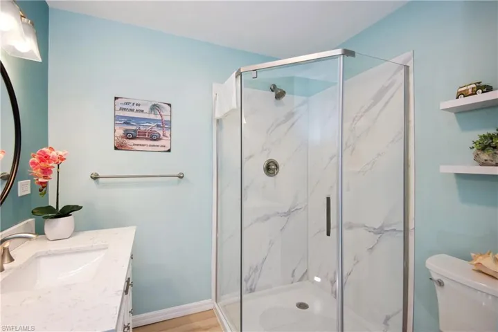 Full bath with vanity and a marble finish shower - Virtually Edited Image