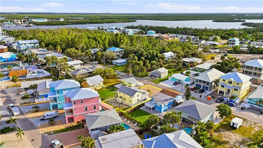 Aerial view of residential area with a large body of water - Virtually Edited Image