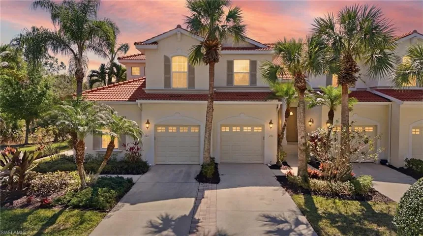Mediterranean / spanish house with driveway, a garage, a tiled roof, and stucco siding