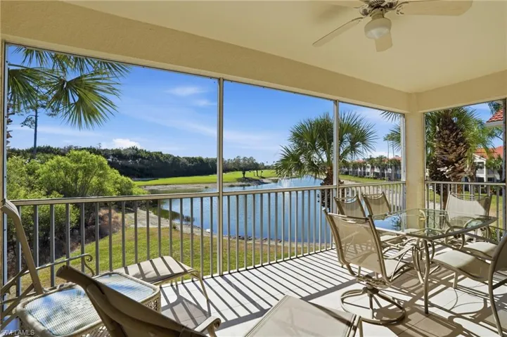 Sunroom / solarium featuring a water view
