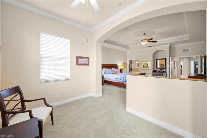 primary sitting room looking into bedroom