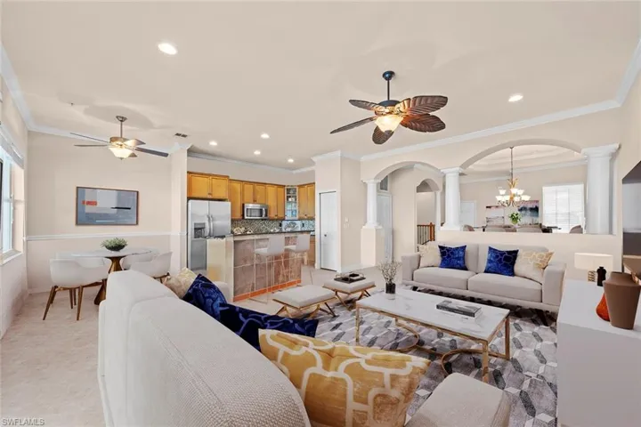 **virtually staged** living looking into kitchen and breakfast nook