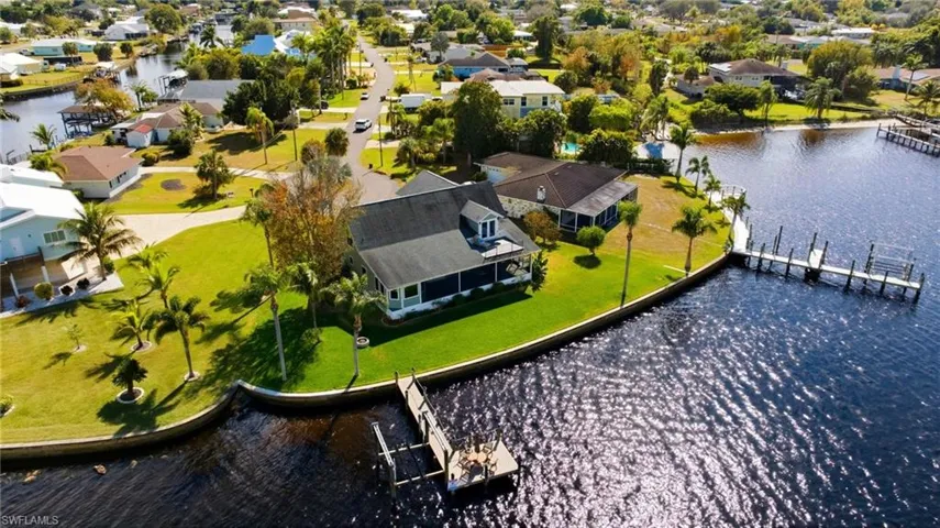 Aerial perspective of suburban area with a large body of water