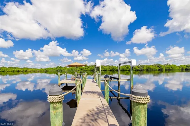 Dock with a river view and boat lift