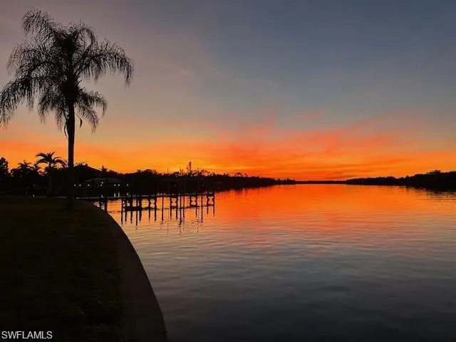 Property view of water featuring a boat dock
