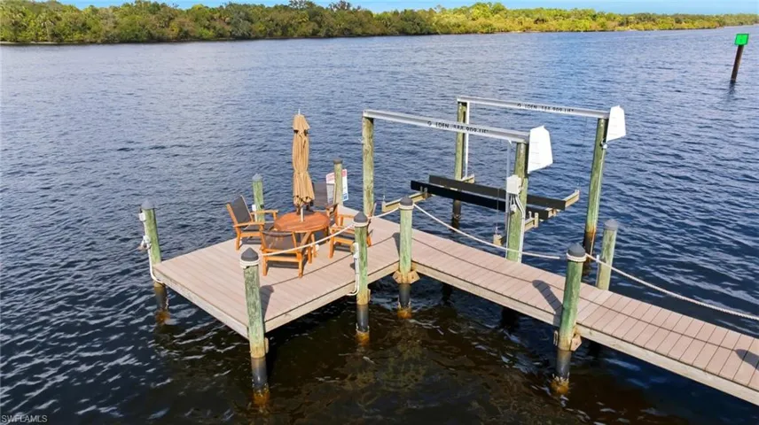 Dock with a water view and boat lift