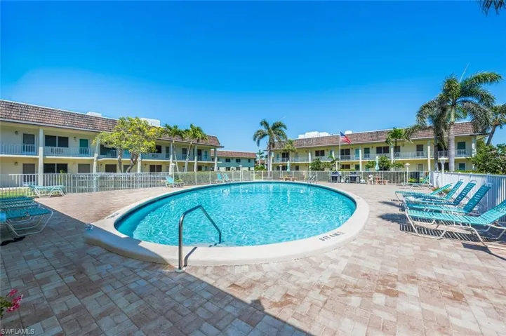 Pool featuring a patio area and fence