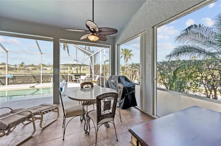Sunroom / solarium featuring ceiling fan and a wealth of natural light