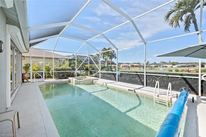 View of pool featuring a lanai