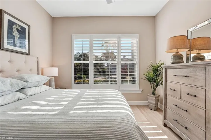 Bedroom featuring light wood-type flooring and a ceiling fan
