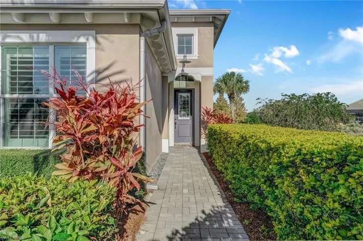 Doorway to property with stucco siding