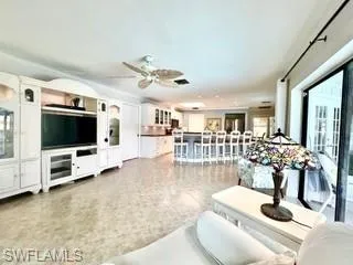 Living room featuring ceiling fan
