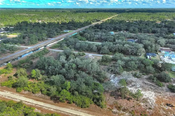 Aerial overview of property's location with a forest