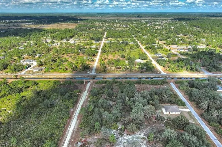 View of property location featuring a heavily wooded area
