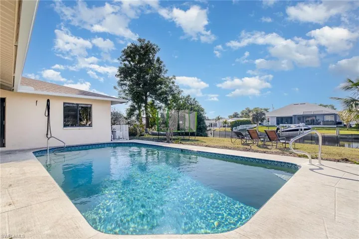 View of pool featuring a patio and a trampoline