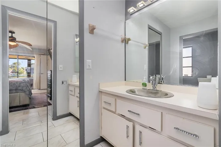 Bathroom featuring vanity and ceiling fan