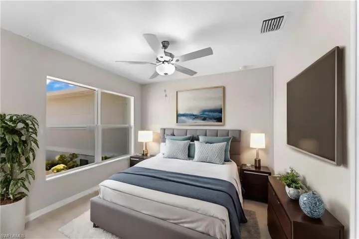 Bedroom with carpet and ceiling fan