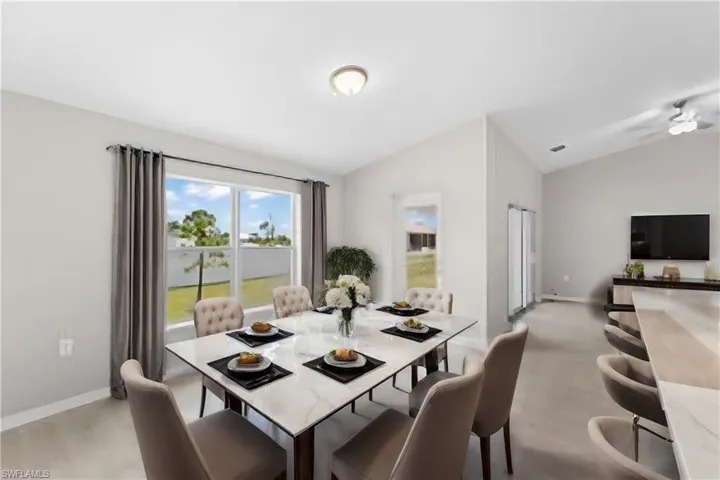 Dining room with vaulted ceiling