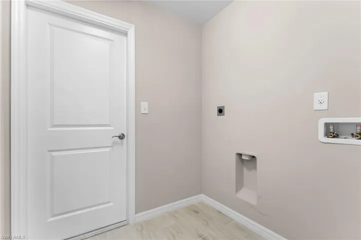 Clothes washing area with hookup for an electric dryer and washer hookup
