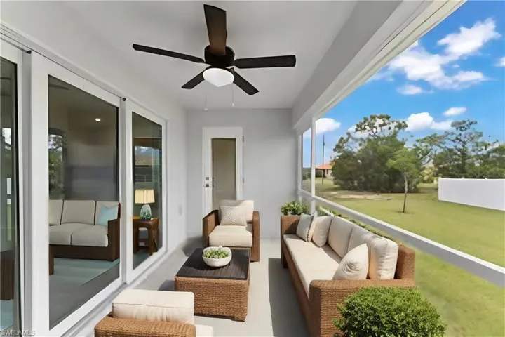 Sunroom featuring ceiling fan