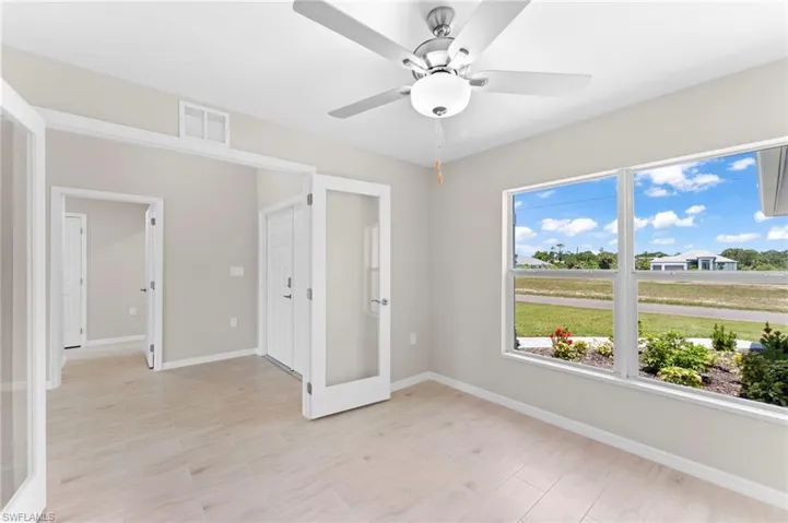 Unfurnished bedroom with light hardwood / wood-style floors and ceiling fan