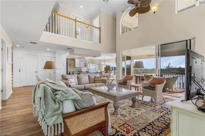 Family and friends will love gathering in the spacious living area with its high ceilings, and wrap-around lanai with awesome views that brings the outside in.