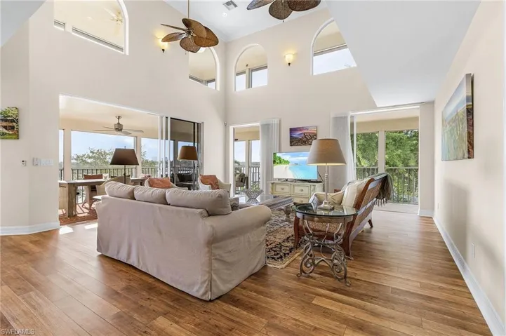 There's plenty of space for Entertaining family and friends in the heart of the home -- Sliding glass doors open out to the wrap-around lanai where additional dining and relaxing areas offer awesome water views.