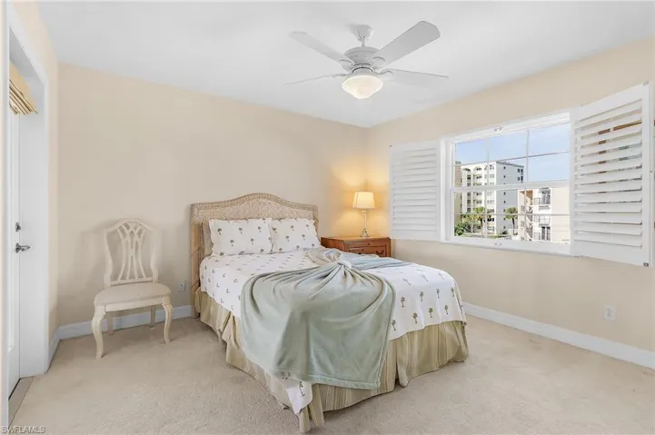 Overnight guests will relish the view of the Gulf of Mexico from this corner bedroom that also offers access to the upper-level lanai.