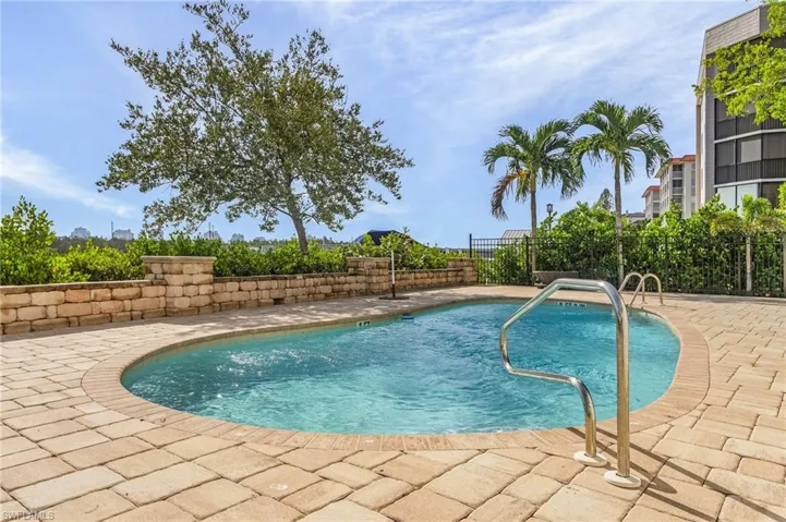 The heated swimming pool features beautiful paver decking.
