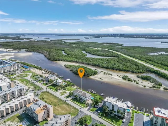 View of the backyard's bay, the road to Lovers Key and Estero Bay beyond.