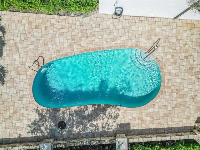 Drone / aerial view of the inviting pool.