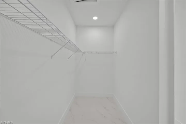 Spacious closet with marble finish flooring