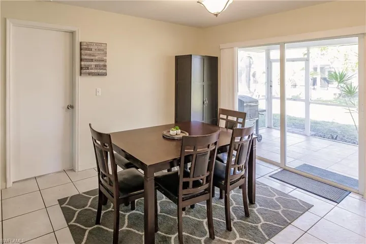 Dining area featuring light tile patterned floors
