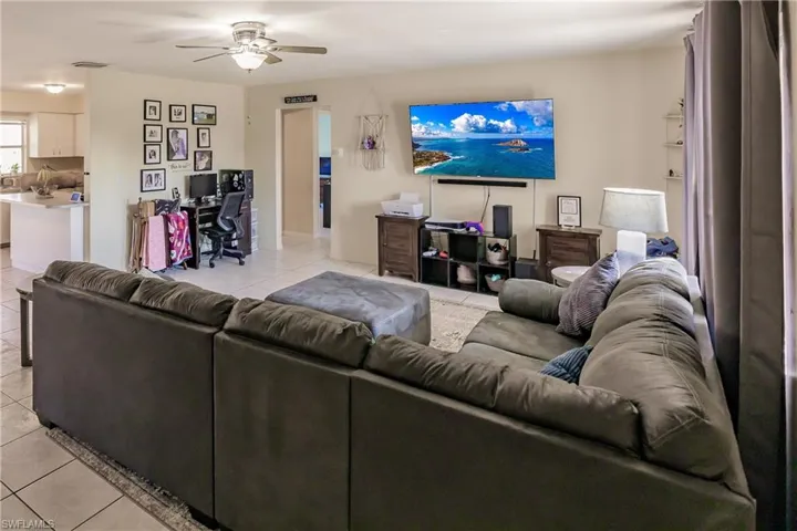 Tiled living room with ceiling fan