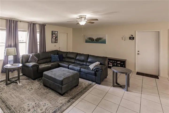 Tiled living room with ceiling fan