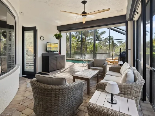 Sunroom featuring an outdoor hangout area, ceiling fan, a patio area, and a pool