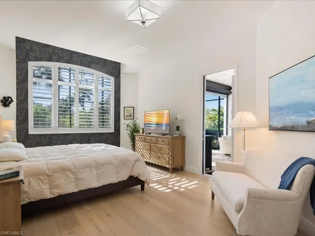 Bedroom featuring wood finished floors and access to outside