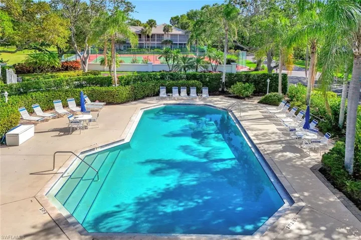 Outdoor swimming pool with integrated steps and concrete decking