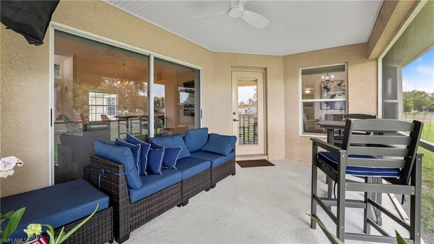 Sunroom / solarium featuring a ceiling fan, an outdoor hangout area, and plenty of natural light