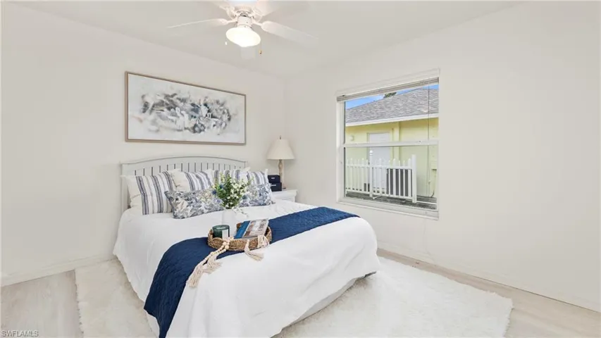 Bedroom with wood finished floors and a ceiling fan