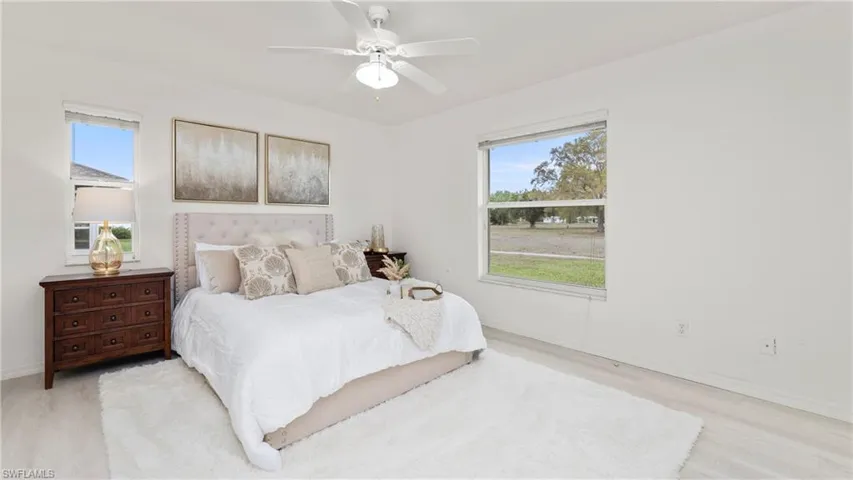 Bedroom featuring a ceiling fan and light wood-style floors