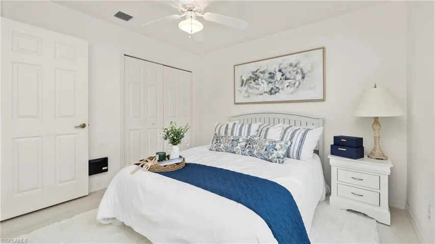 Bedroom featuring a ceiling fan and a closet