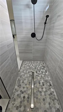 Bathroom with tiled shower