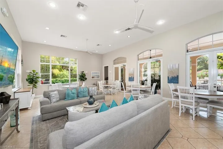 Community clubhouse with high ceilings, ceiling fan, French doors, recessed lighting, and abundant light.