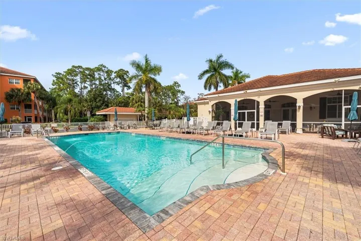 Community pool featuring a patio