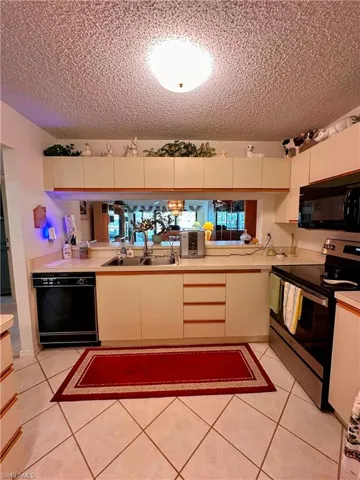 Kitchen featuring pass through to dining area
