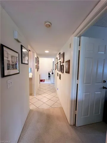 Corridor  with entrance to third room/den/office