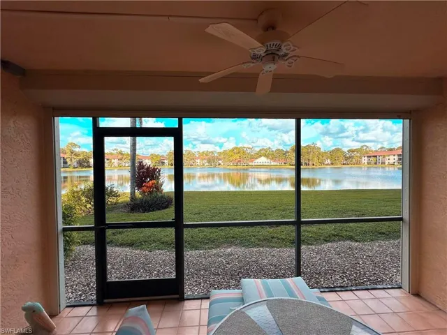 Sunroom with a water view, a ceiling fan, and plenty of natural light